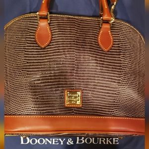 Dooney & Bourke handle bag with strap.